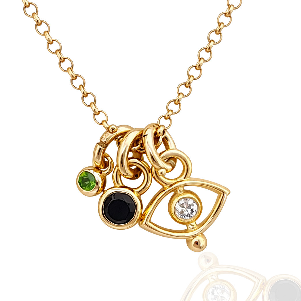 Gold necklace with eye-shaped pendant and colored gemstones on a white background
